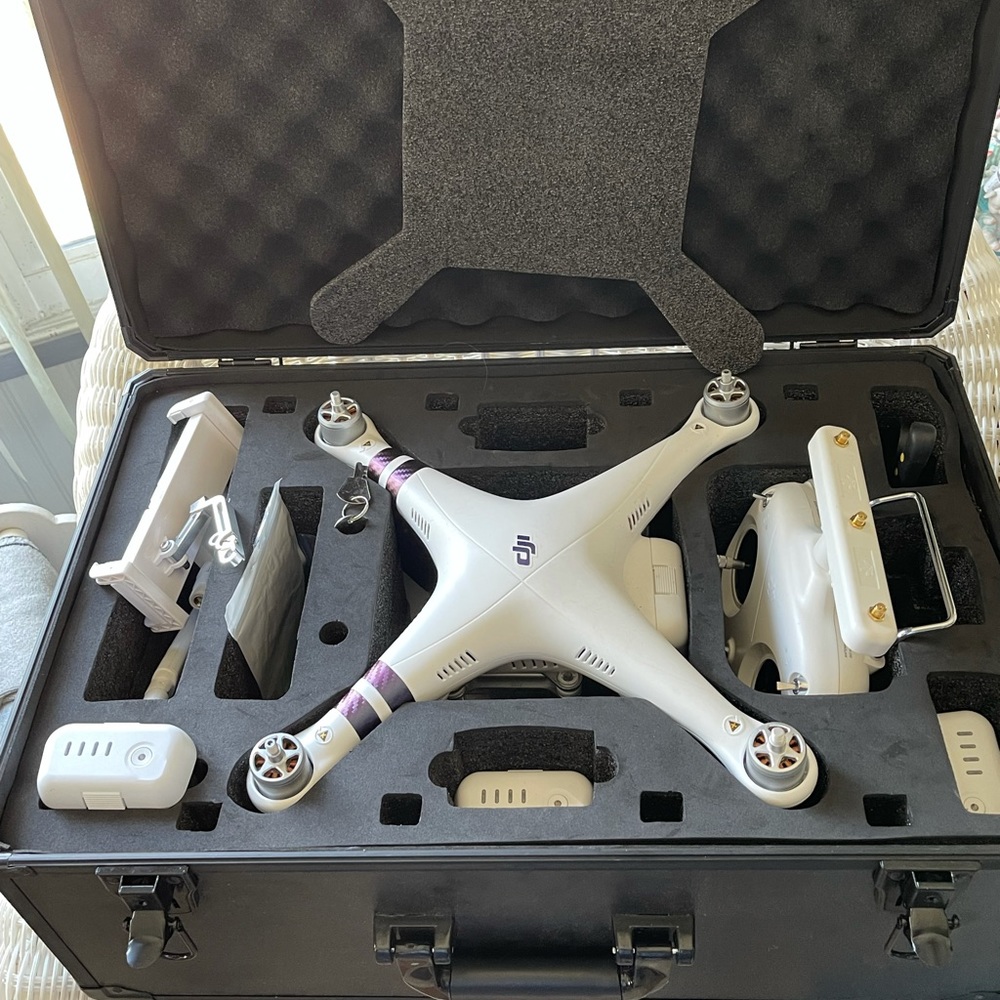 DJI Phantom 3 Drone; 4 batteries; extra props